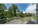 Newly constructed deck with white railing offering scenic backyard views at 893 Somersby Dr, Dallas, GA 30157