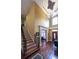 Grand foyer featuring soaring ceilings, elegant chandelier, and hardwood floors, creating a welcoming entrance at 893 Somersby Dr, Dallas, GA 30157