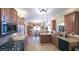 Open kitchen boasts granite countertops, stainless steel appliances, and adjacent dining area at 893 Somersby Dr, Dallas, GA 30157