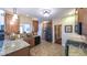 Bright eat-in kitchen featuring granite counters, tile backsplash, stainless steel appliances, and wood cabinets at 893 Somersby Dr, Dallas, GA 30157