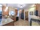 Spacious kitchen features granite countertops, stainless steel appliances, and tile flooring at 893 Somersby Dr, Dallas, GA 30157