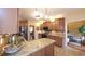 A full kitchen view with granite countertops, stainless steel appliances, and custom backsplash at 893 Somersby Dr, Dallas, GA 30157