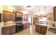 Spacious kitchen with granite countertops, stainless steel appliances, and adjacent dining area for convenience at 893 Somersby Dr, Dallas, GA 30157
