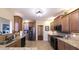 Well-equipped kitchen with stainless steel appliances, granite countertops, and ample cabinet space, ideal for culinary enthusiasts at 893 Somersby Dr, Dallas, GA 30157