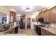 Modern kitchen with stainless steel appliances, granite countertops, and ample cabinet space at 893 Somersby Dr, Dallas, GA 30157