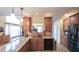 Well-lit kitchen with granite countertops, stainless steel appliances, and a functional layout for cooking at 893 Somersby Dr, Dallas, GA 30157