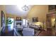 Comfortable living room features high ceilings, neutral walls, fireplace, natural light, and elegant furnishings, ideal for relaxing at 893 Somersby Dr, Dallas, GA 30157