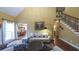 Inviting living room adjacent to the dining area with hardwood floors, neutral tones, and large windows for a bright, open feel at 893 Somersby Dr, Dallas, GA 30157
