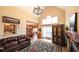 Open-concept living room featuring a fireplace, tile flooring, and seamless flow to the dining area, great for gatherings at 893 Somersby Dr, Dallas, GA 30157