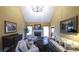 Bright living room featuring a fireplace, high ceilings, natural light, and comfortable seating, creating a warm atmosphere at 893 Somersby Dr, Dallas, GA 30157