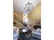 Open living room with tall ceilings, decorative chandelier, and comfortable seating area for guests at 893 Somersby Dr, Dallas, GA 30157