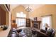 Comfortable living room with a stone fireplace, tile floors, and vaulted ceilings provides a relaxing atmosphere at 893 Somersby Dr, Dallas, GA 30157