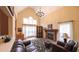 Welcoming living room with stone fireplace, large windows, vaulted ceilings, offering a relaxing and inviting space at 893 Somersby Dr, Dallas, GA 30157