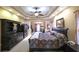Spacious main bedroom with tray ceilings, sitting area, and decorative furnishings at 893 Somersby Dr, Dallas, GA 30157
