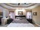 Elegant main bedroom boasts tray ceilings, decorative columns, and neutral color scheme at 893 Somersby Dr, Dallas, GA 30157