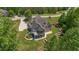 Elevated aerial angle displaying backyard, spacious lawn, deck, patio, and retaining wall at 893 Somersby Dr, Dallas, GA 30157