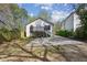 Large backyard with a deck, concrete pad and lush greenery at 1833 Flat Shoals Se Rd, Atlanta, GA 30316