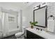 Charming bathroom with black and white subway tile, a vanity and a shower-tub combination at 1833 Flat Shoals Se Rd, Atlanta, GA 30316
