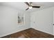 Airy bedroom with ceiling fan, a sunlit window and hardwood floors at 1833 Flat Shoals Se Rd, Atlanta, GA 30316