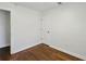 Clean and simple bedroom featuring hardwood floors, white walls and a built-in closet at 1833 Flat Shoals Se Rd, Atlanta, GA 30316