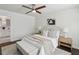 Comfortable bedroom featuring a tufted headboard, neutral color palette, and wood flooring at 1833 Flat Shoals Se Rd, Atlanta, GA 30316