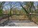 Enjoy the outdoors on this wooden deck overlooking a spacious and green backyard at 1833 Flat Shoals Se Rd, Atlanta, GA 30316