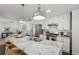 Bright kitchen with white cabinets, granite countertops, stainless appliances, and center island at 1833 Flat Shoals Se Rd, Atlanta, GA 30316