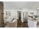 An open-concept kitchen showcasing stainless steel appliances and a granite island countertop at 1833 Flat Shoals Se Rd, Atlanta, GA 30316