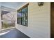 A cozy front porch featuring a light blue ceiling, white siding, and dark framed windows at 1833 Flat Shoals Se Rd, Atlanta, GA 30316
