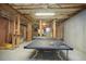 Unfinished basement featuring a ping pong table with room for activities at 208 Grandmar, Canton, GA 30115