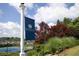 Community sign with tennis courts, mature landscaping, and clubhouse in the background at 208 Grandmar, Canton, GA 30115