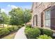 Well-maintained exterior with landscaped yard, brick facade, and decorative shutters adding curb appeal at 208 Grandmar, Canton, GA 30115