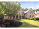 Charming brick home with a welcoming front porch and mature landscaping at 208 Grandmar, Canton, GA 30115