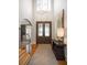 Elegant foyer featuring hardwood floors, a staircase, and stylish decor, leading to other rooms in the home at 208 Grandmar, Canton, GA 30115
