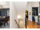 Bright hallway featuring hardwood floors, a view of the dining room, and stylish archways into other rooms at 208 Grandmar, Canton, GA 30115