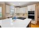 Spacious kitchen with a kitchen island, stainless appliances, and custom cabinetry at 208 Grandmar, Canton, GA 30115