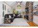 Comfortable living room with stone fireplace, a vaulted ceiling, and plenty of light at 208 Grandmar, Canton, GA 30115