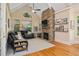 Cozy living room with fireplace, large windows, and a vaulted ceiling at 208 Grandmar, Canton, GA 30115