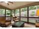 Relaxing screened-in porch overlooking landscaped yard, perfect for enjoying the outdoors at 208 Grandmar, Canton, GA 30115