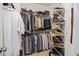 Well-organized walk-in closet with ample hanging space and shelving for efficient storage of clothing and accessories at 208 Grandmar, Canton, GA 30115