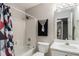 Bathroom features a shower-tub combo and vanity sink at 228 Kensington Trce, Stockbridge, GA 30281