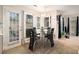 Sunny breakfast nook featuring modern table set, backyard access, and ample natural light at 228 Kensington Trce, Stockbridge, GA 30281