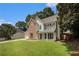 Attractive two-story home with landscaped lawn, attached garage, and brick and siding exterior details at 228 Kensington Trce, Stockbridge, GA 30281