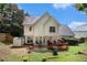Exterior back of home featuring a grill, patio, deck, shed and lawn at 228 Kensington Trce, Stockbridge, GA 30281