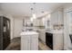 Updated kitchen featuring modern cabinetry, stainless steel appliances, and a stylish backsplash at 228 Kensington Trce, Stockbridge, GA 30281