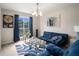 Comfortable seating area offering natural light, blue accents, and decorative pieces for stylish living at 228 Kensington Trce, Stockbridge, GA 30281