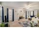 Sunlit living room featuring a fireplace, plush seating, and elegant decor, with neutral walls and carpeting at 228 Kensington Trce, Stockbridge, GA 30281
