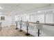 Basement bar area with white stools, wooden countertop, and recessed lighting at 2436 Ovidia Sw Cir, Atlanta, GA 30311