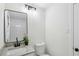 Cozy bathroom features granite counters, brushed nickel fixtures, and a large mirror at 2436 Ovidia Sw Cir, Atlanta, GA 30311