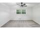 Bedroom with neutral carpet, large window and ceiling fan at 2436 Ovidia Sw Cir, Atlanta, GA 30311